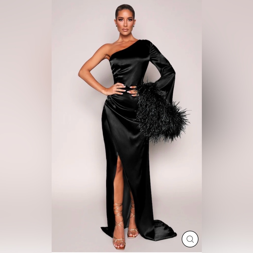 Worn once. Silk aymmetric neckline and bell sleeve trimmed in ostrich feathers.